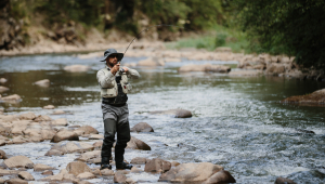 A man fishing in a stream