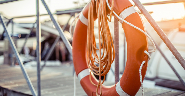 A life preserver on a boat gangplank