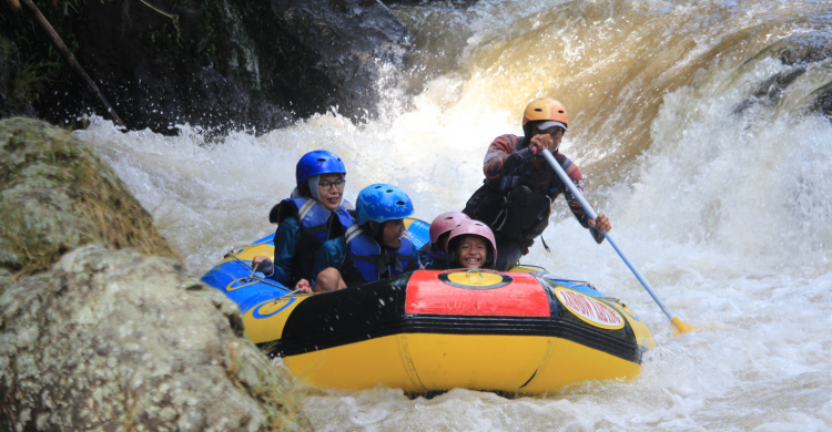 A family going whitewater-rafting