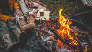 People toasting marshmallows over a campfire