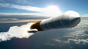 A rocket launching on an angle into a blue sky