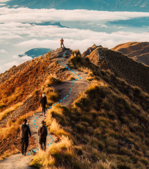 People climbing up a steep mountain path