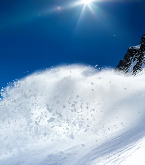 An avalanche in a snowy landscape