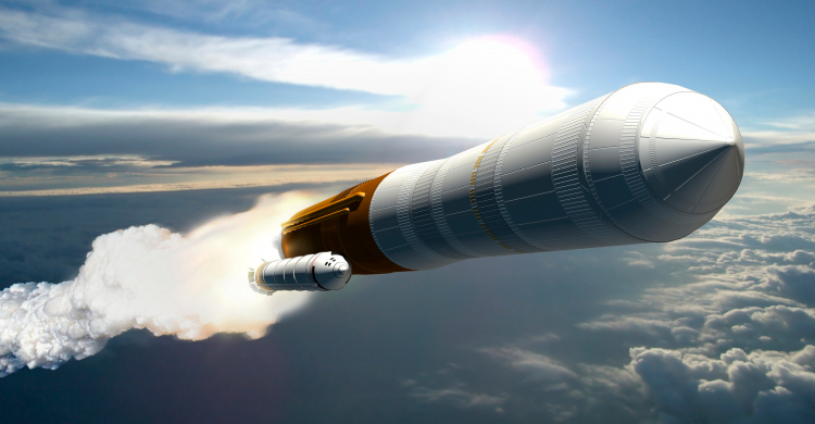 A rocket launching on an angle into a blue sky
